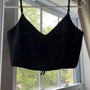 Lulus black two piece jumpsuit including crop top and open flared pants.Small